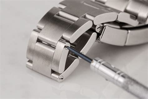 adding links to rolex watch.